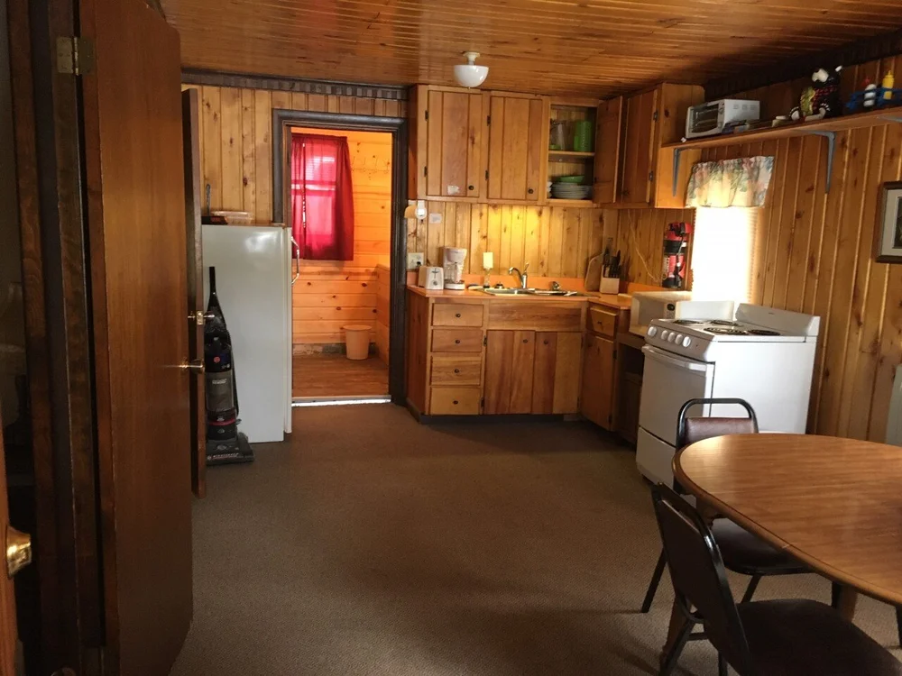 Cabin 1 fully equipped kitchen and dining area